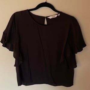 Cute little flutter sleeve black crop blouse. Parisian vibes!